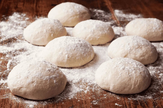 Fresh baked croissants on a tray — perfect laminated dough result before using a dough sheeter